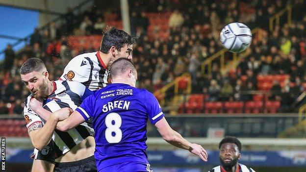 Shaun Pearson in action for Grimsby Town against FC Halifax Town during the 2021-22 season