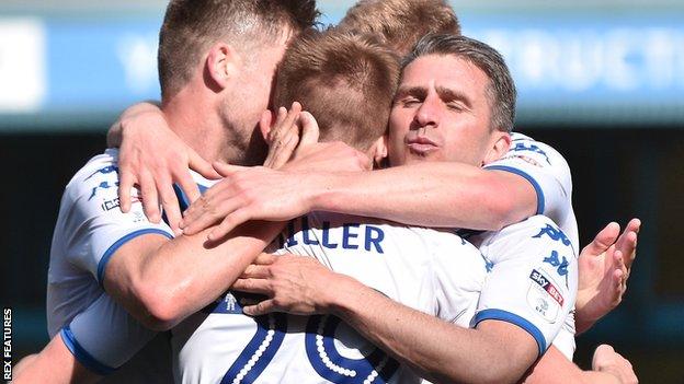 Ryan Lowe and George Miller celebrate a Bury goal