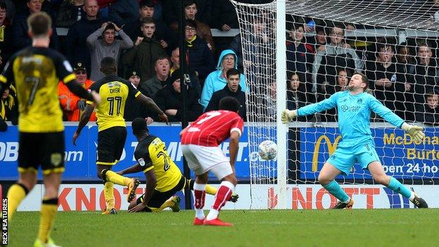 Bristol City goalkeeper Frank Fielding makes a save against Burton