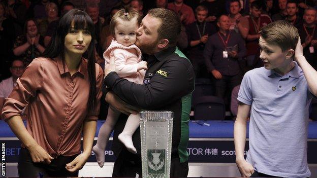 Mark Allen celebrates with his family after landing the £70,000 top prize in Glasgow