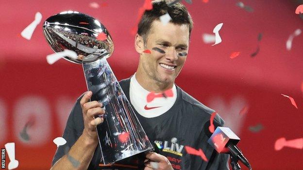 Tampa Bay Buccaneers quarterback Tom Brady holds the Vince Lombardi Trophy