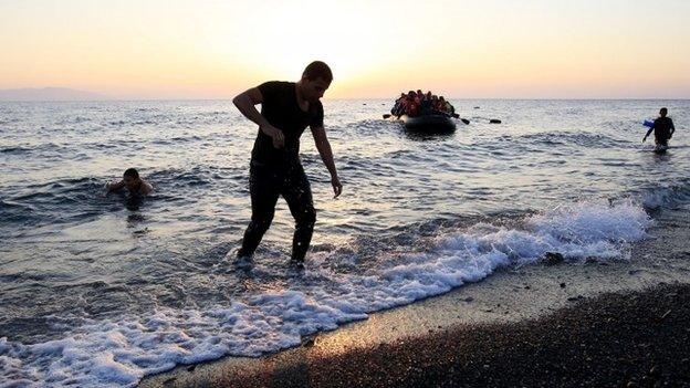 Picture of migrants and refugees coming ashore on the island of Kos, Greece