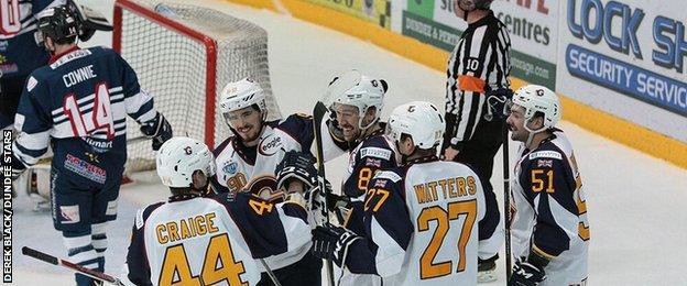 Guildford players celebrate after a 5-0 shutout win over Dundee Stars on Saturday