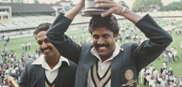 Kapil Dev holds the World Cup trophy on his head