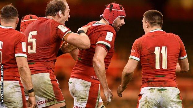 Cory Hill is congratulate by Wales captain Alun Wyn Jones after scoring a try in the 2021 Triple Crown win against England