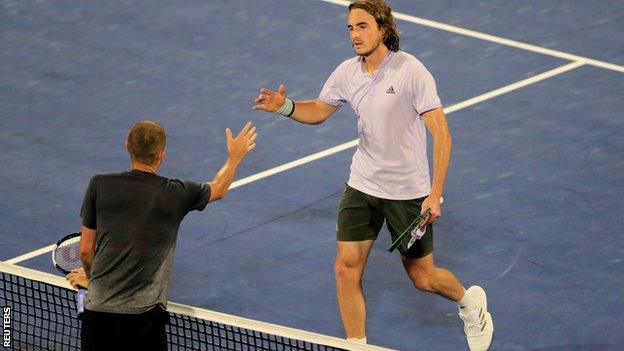 Stefano Tsitsipas shakes Dan Evans' hand after the Greek's victory in the semi-finals of the Dubai Tennis Championships