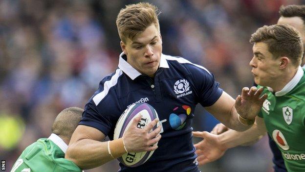 Huw Jones (centre) in action for Scotland