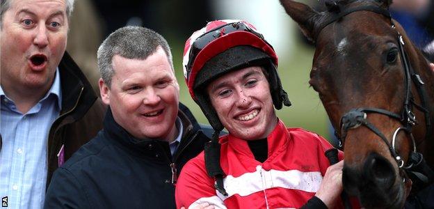 Gordon Elliott celebrates a victory with teenage jockey Jack Kennedy