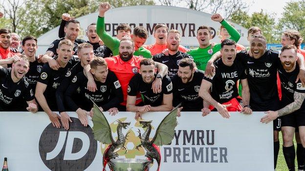 Connah's Quay players celebrate after clinching the Cymru Premier title at Penybont