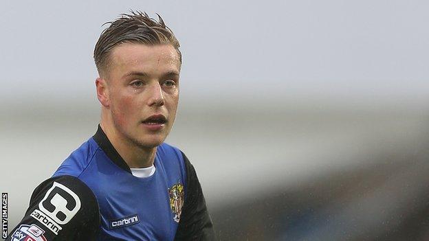 Tom Conlon plays for Stevenage against Northampton Town in League Two in 2015