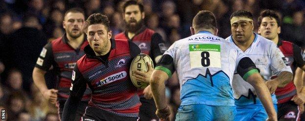 Edinburgh's Jack Cuthbert tries to break through the Glasgow defence