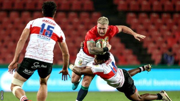 Stuart Hogg runs with the ball