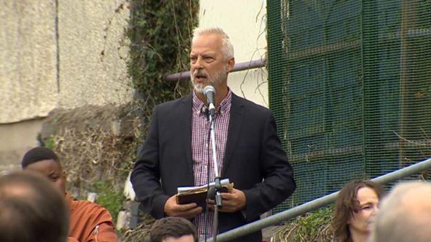 Pastor Andrew Cleverly outside the fire-damaged Bethel Community Church