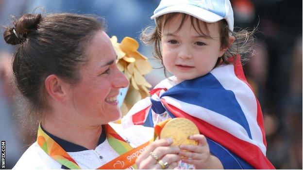 Sarah Storey and her daughter Louisa hold her gold medal at the Rio 2016 Paralympics