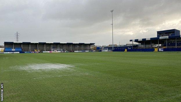 Standing water at Barrow's The Dunes Hotel Stadium home came after downpours following Storm Barra on Tuesday