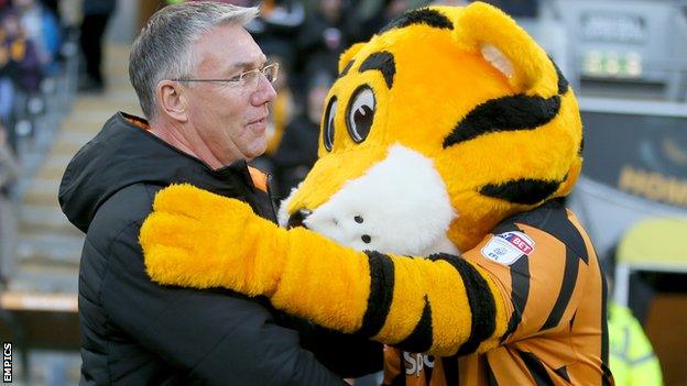 Nigel Adkins is hugged by Hull City's mascot