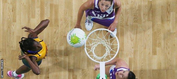 Nikita Payne of Barbados scores a goal against Scotland during Netball