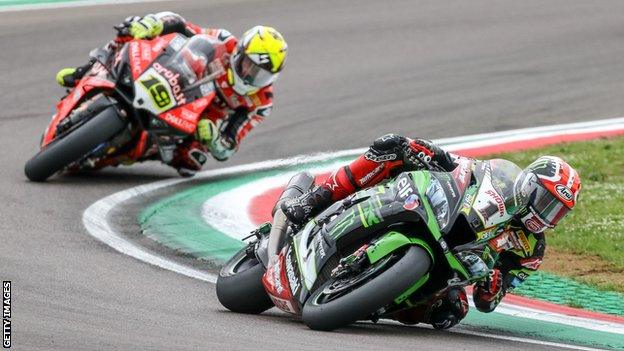 Jonathan Rea (right) battles with Alvaro Bautista at Imola in May