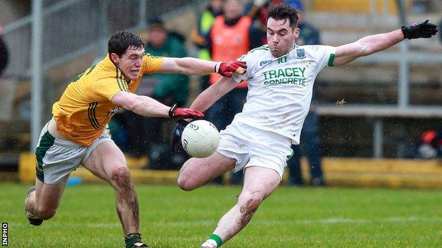 Meath's Padraic Harnan attempts to get a block in as Fermanagh forward Barry Mulrone takes a shot