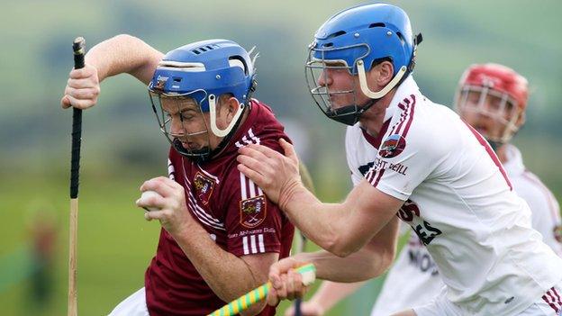 Slaughtneil's Jarlath Mulholland battles with Cushendall's Paddy McGill in last year's Ulster semi-final won by the Antrim champions after a replay