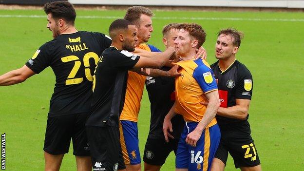 Mansfield and Harrogate players clash