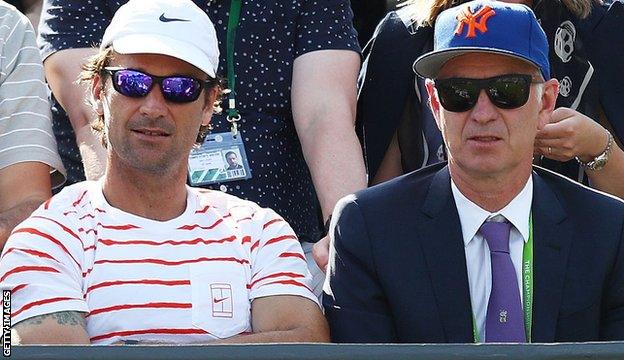 John McEnroe (left)