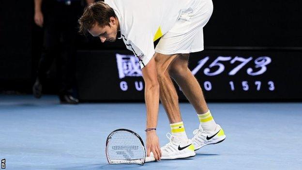 Daniil Medvedev picks up broken racquet during Australian Open final