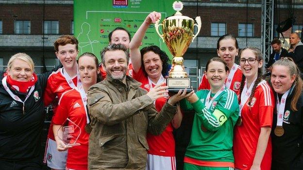 Michael Sheen helps the Wales women's team celebrate their tournament win