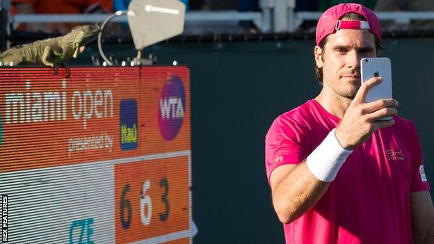 An iguana caused a brief play interruption and commotion in the stands at the Miami Open