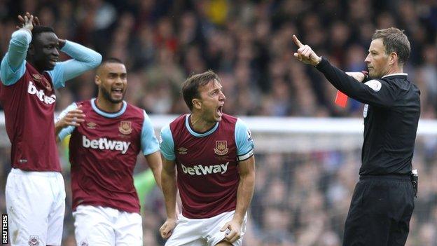 Mark Clattenburg sends off Cheikhou Kouyate (left)