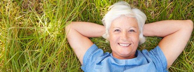 Woman lying on grass