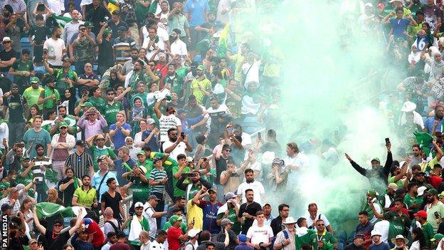 Pakistan fans let off a flare after they beat Afghanistan