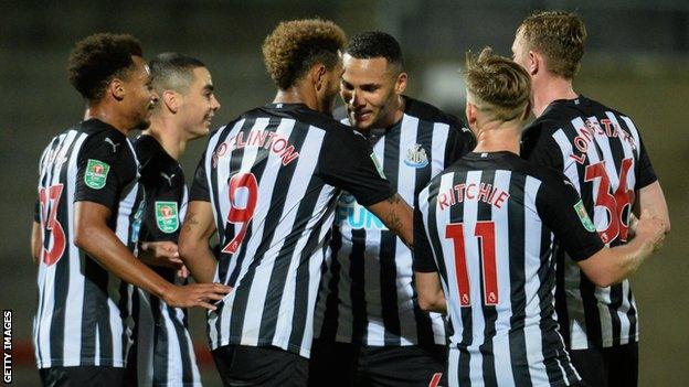 Joelinton celebrates with Newcastle team-mates