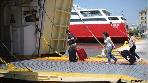 tourists boarding ferry at Piraeus port