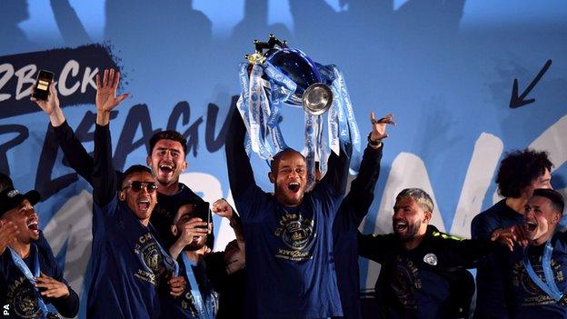 Vincent Kompany lifts the Premier League trophy