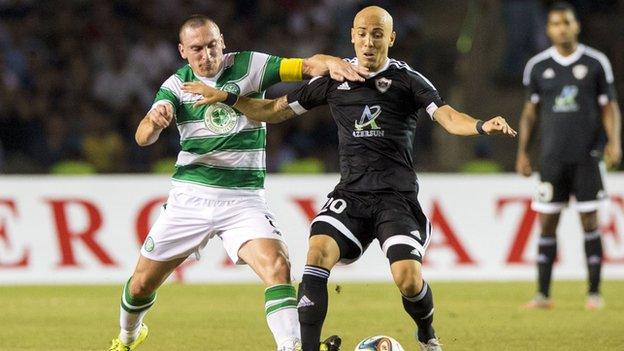 Celtic's Scott Brown (left) battles with Richard Almeida