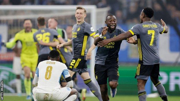 Lutsharel Geertruida and Luis Sinisterra celebrate Feyenoord's victory as Marseille's Gerson looks deflated