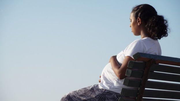 Woman sitting on bench