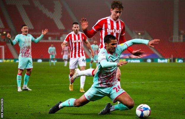 Swansea City earned a penalty after Kyle Naughton went down in the box at Stoke