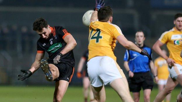 Armagh midfielder Stephen Sheridan sees his shot blocked by Saffrons forward Conor Murray