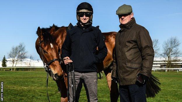 Ballyward is pictured with Willie Mullins, right, and his son Patrick who rode the the seven-year-old in his final race at Cheltenham on Tuesday