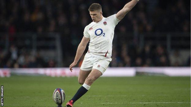 Owen Farrell kicks the ball