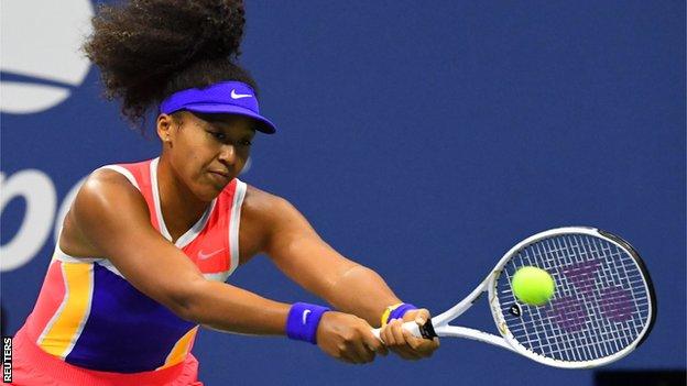 Naomi Osaka returns a ball in her 2020 US Open semi-final against Jennifer Brady