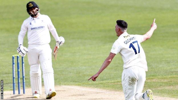 Nathan Gilchrist celebrates taking the wicket of Dan Ibrahim