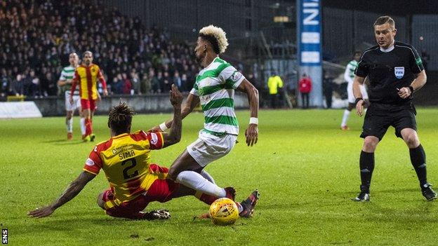 Scott Sinclair is brought down in the box by Mustapha Dumbuya