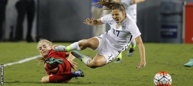 England's Alex Greenwood tackles Tobin Heath