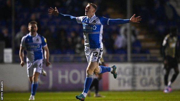 Elliot Anderson celebrates his goal against Colchester United