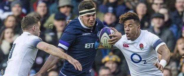 Stuart McInally carries the ball for Scotland against England