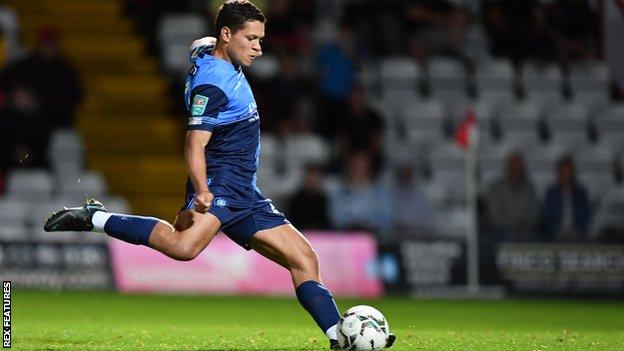 Tjay De Barr scores the winning penalty for Wycombe