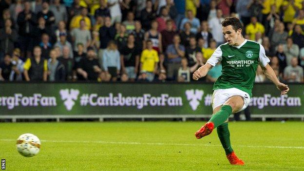 John McGinn side-foots his penalty but it is saved by Brondy keeper Frederik Ronnow